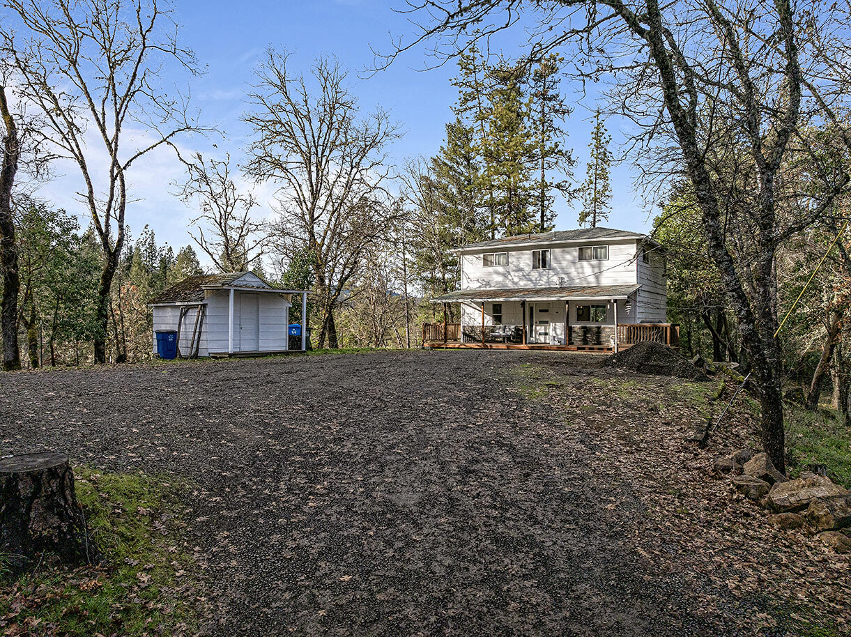 2900 Indian Creek Road Shady Cove, OR 97539 - Photo 2 of 35 a view of a house with a yard and tree s