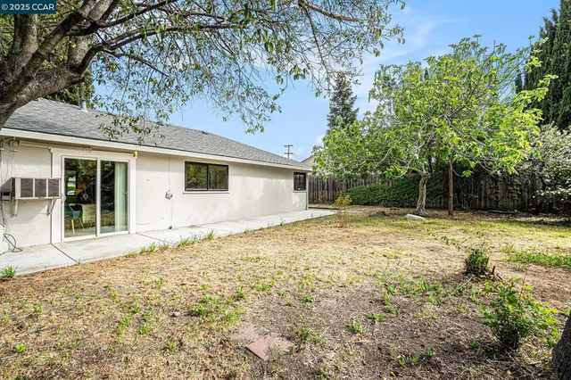 a house with trees in the background