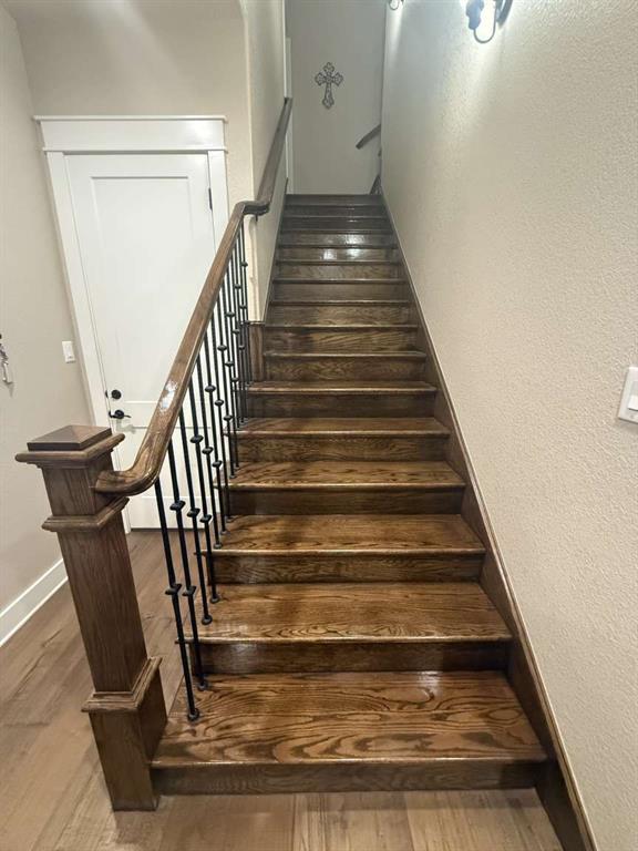 125 Lucky Ridge Lane Boyd, TX 76023 - Photo 24 of 29 Staircase with wood finished floors and baseboards