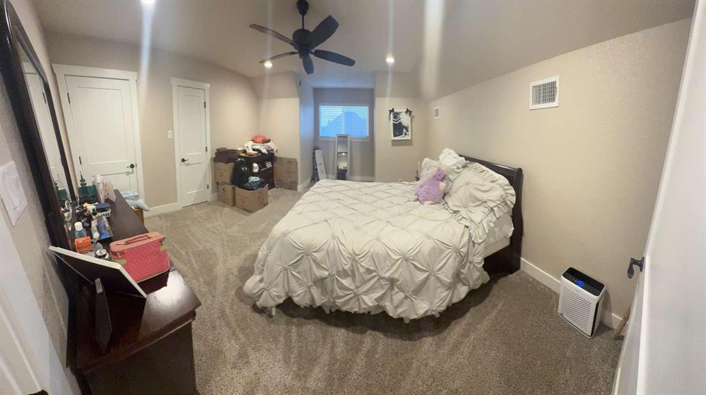 125 Lucky Ridge Lane Boyd, TX 76023 - Photo 26 of 29 Carpeted bedroom featuring baseboards and a ceiling fan