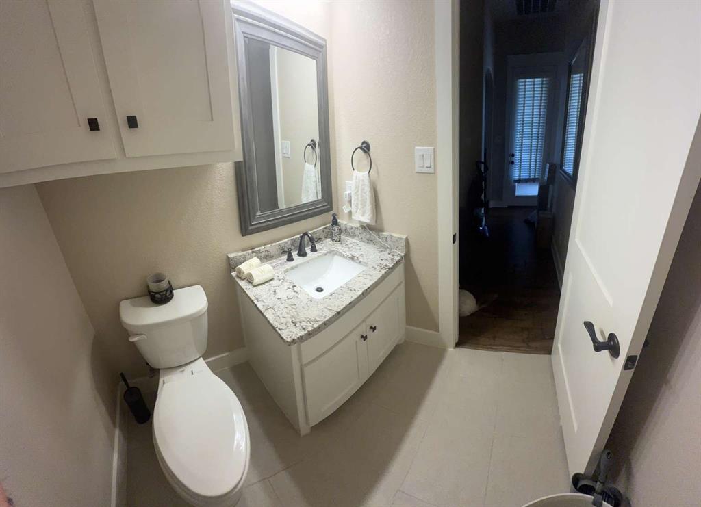 125 Lucky Ridge Lane Boyd, TX 76023 - Photo 28 of 29 Bathroom with vanity and tile patterned floors