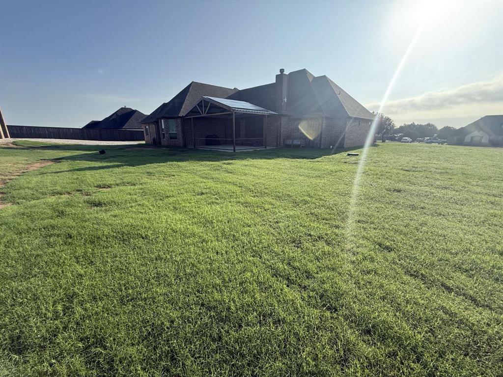 125 Lucky Ridge Lane Boyd, TX 76023 - Photo 6 of 29 View of green lawn with a lanai