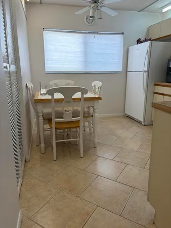 a kitchen with stainless steel appliances a stove a sink and a refrigerator