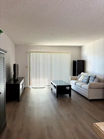a bedroom with furniture and window