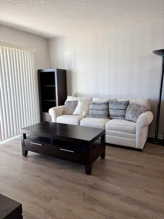 a bedroom with bed and a ceiling fan