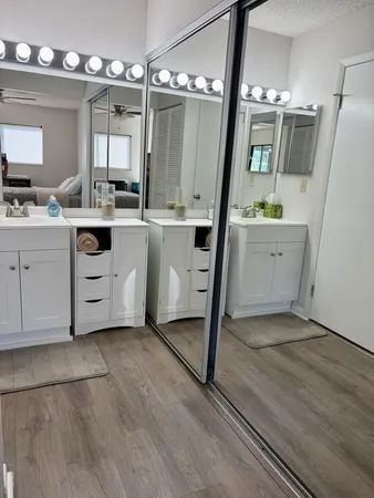 a utility room with cabinets washer and dryer