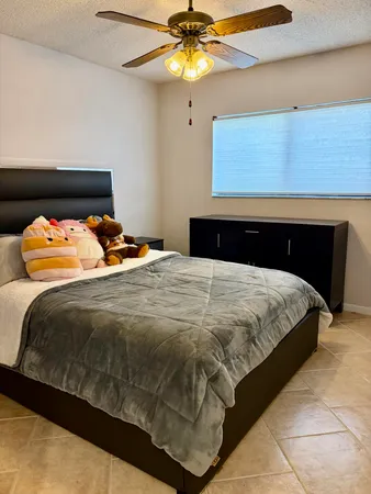 a bedroom with a bed and a closet
