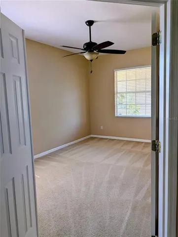 a view of empty room with windows