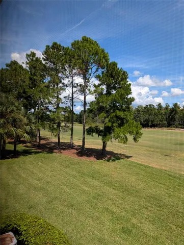 a view of swimming pool with a yard