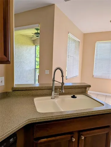 a bathroom with a sink and a window