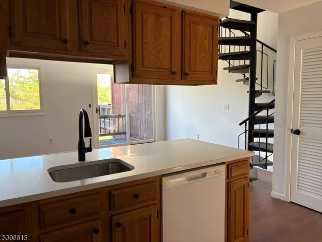 a kitchen with sink and cabinets