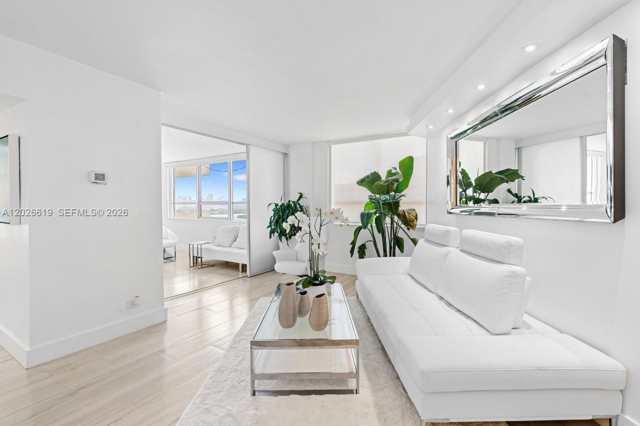 1500 Bay Road, Unit 1268S Miami Beach, FL 33139 - Photo 11 of 31 a living room with furniture and a potted plant