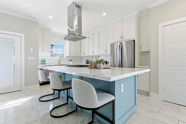 a kitchen with granite countertop a counter space a sink appliances and cabinets