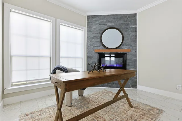 a living room with a table chair and a window