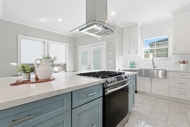 a kitchen with a sink stove and cabinets