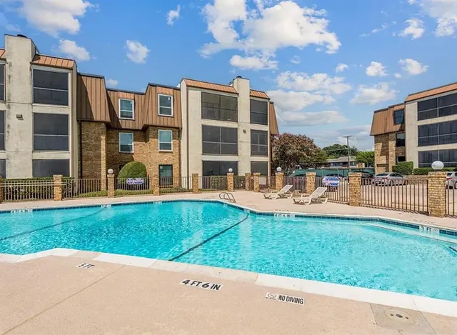 a view of a building with a yard