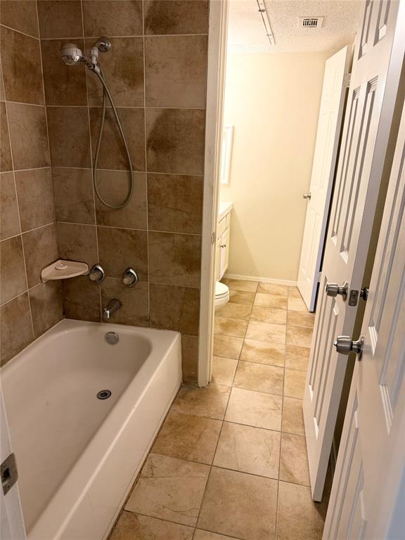 11450 Audelia Road, Unit 304 Dallas, TX 75243 - Photo 6 of 9 a bathroom with a bathtub and a shower