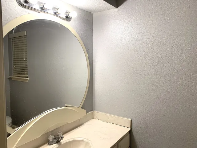 a bathroom with a sink and toilet