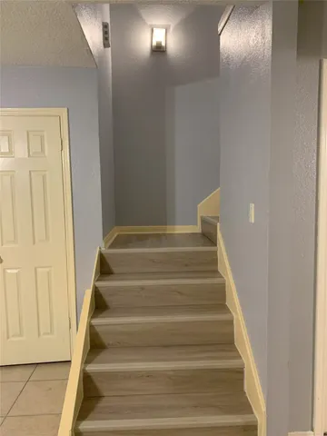 a view of staircase with white walls