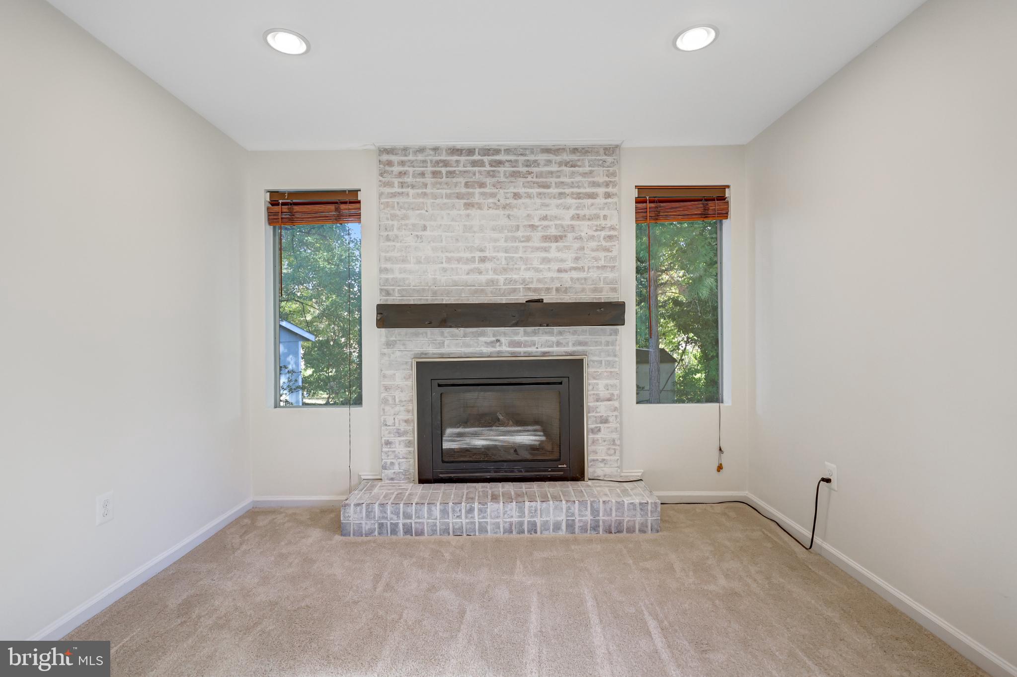 5609 Rolling Road Springfield, VA 22151 - Photo 18 of 42 Cozy living space with a charming fireplace.