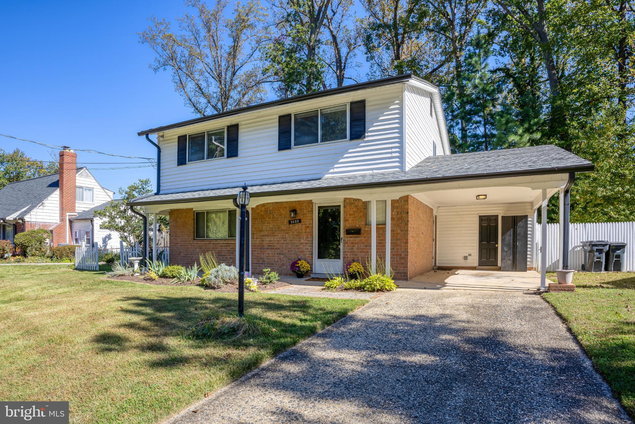 5609 Rolling Road Springfield, VA 22151 - Photo 2 of 42 Charming two-story home with lush greenery.