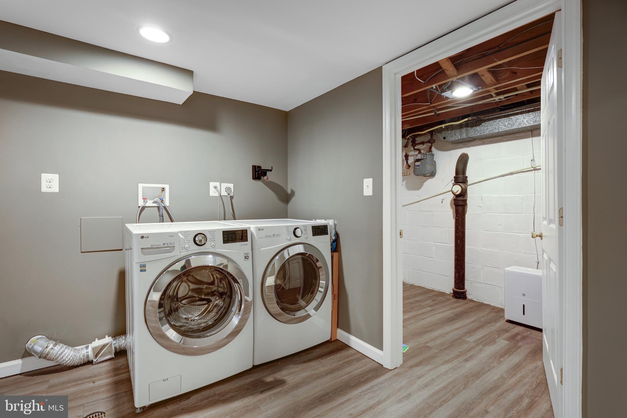 5609 Rolling Road Springfield, VA 22151 - Photo 21 of 42 Modern laundry space with sleek appliances.