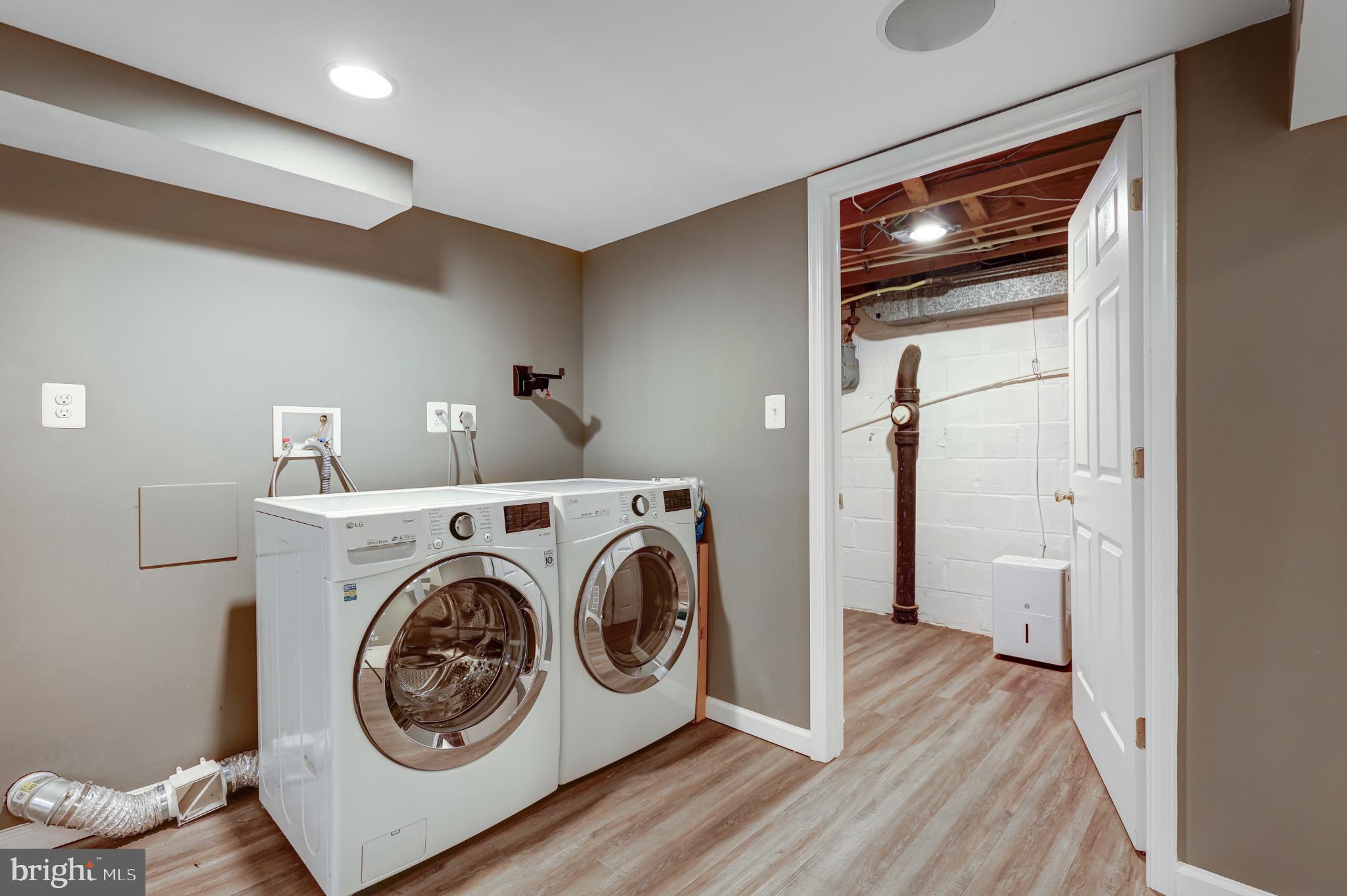 5609 Rolling Road Springfield, VA 22151 - Photo 22 of 42 Modern laundry space with sleek appliances.