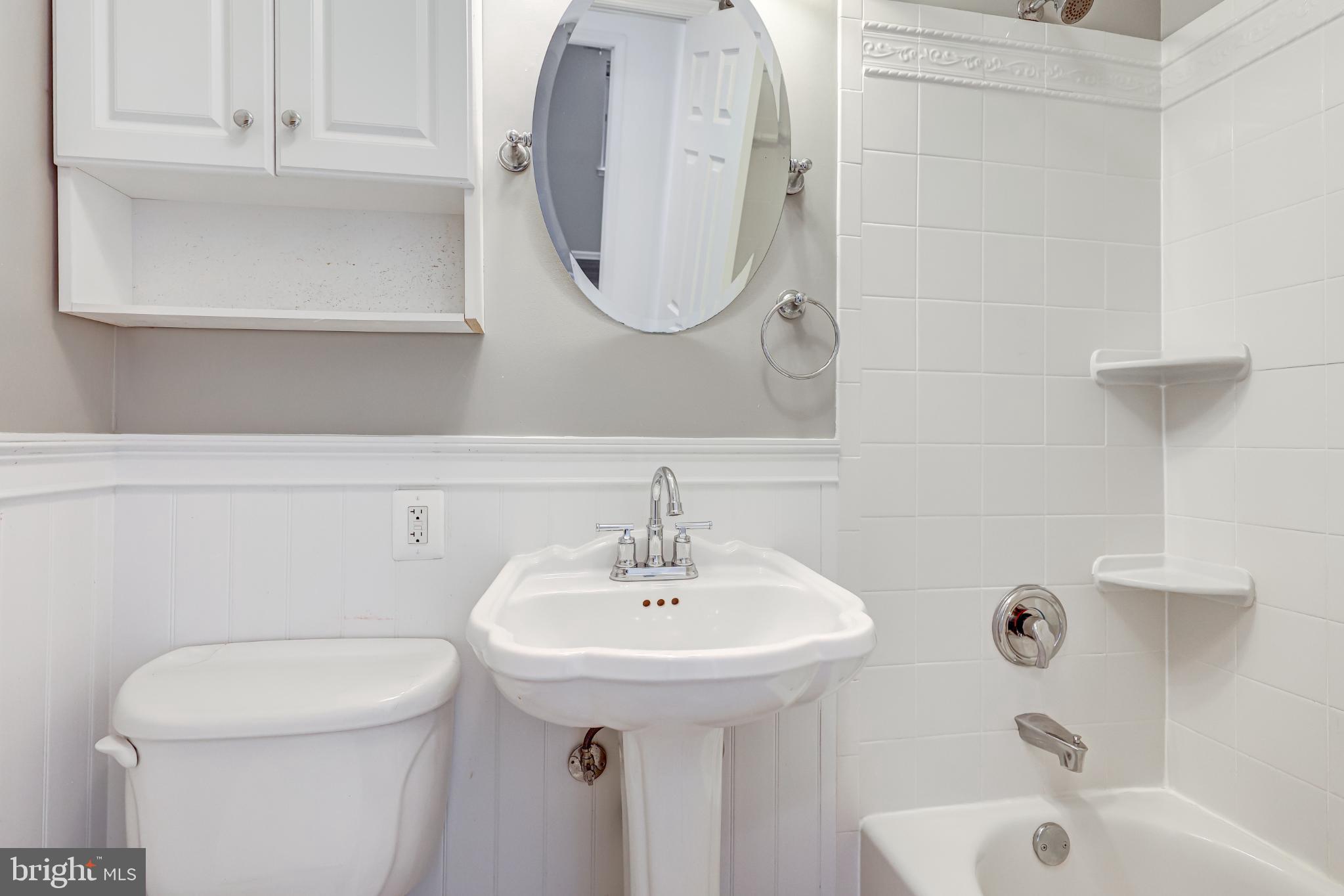 5609 Rolling Road Springfield, VA 22151 - Photo 25 of 42 Charming bathroom with classic fixtures.