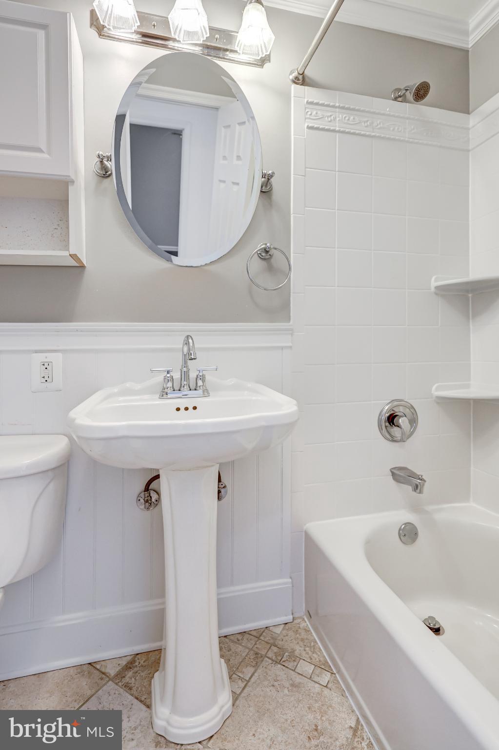 5609 Rolling Road Springfield, VA 22151 - Photo 26 of 42 Charming bathroom with classic elegance.