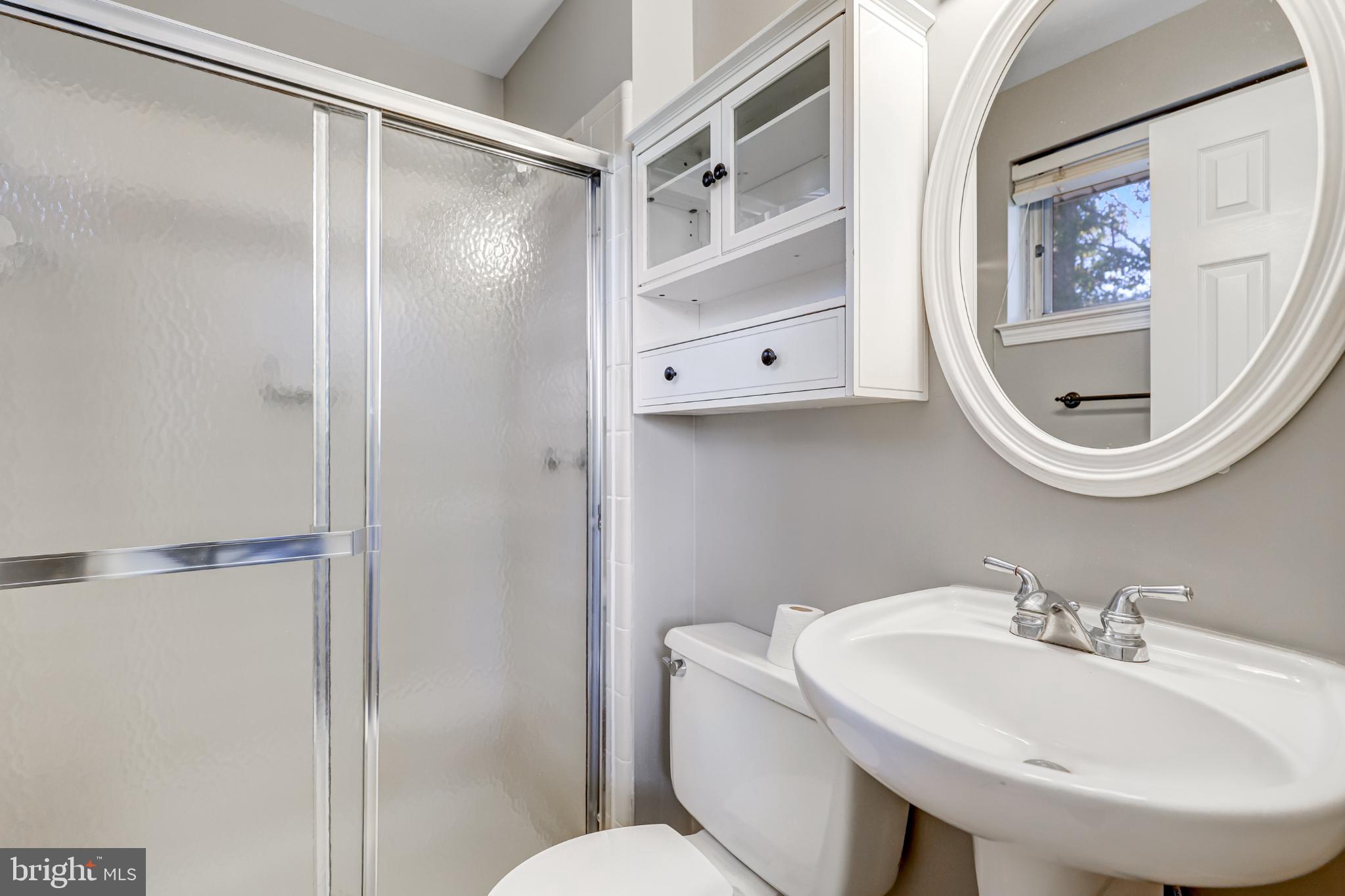5609 Rolling Road Springfield, VA 22151 - Photo 34 of 42 Modern bathroom with sleek finishes.