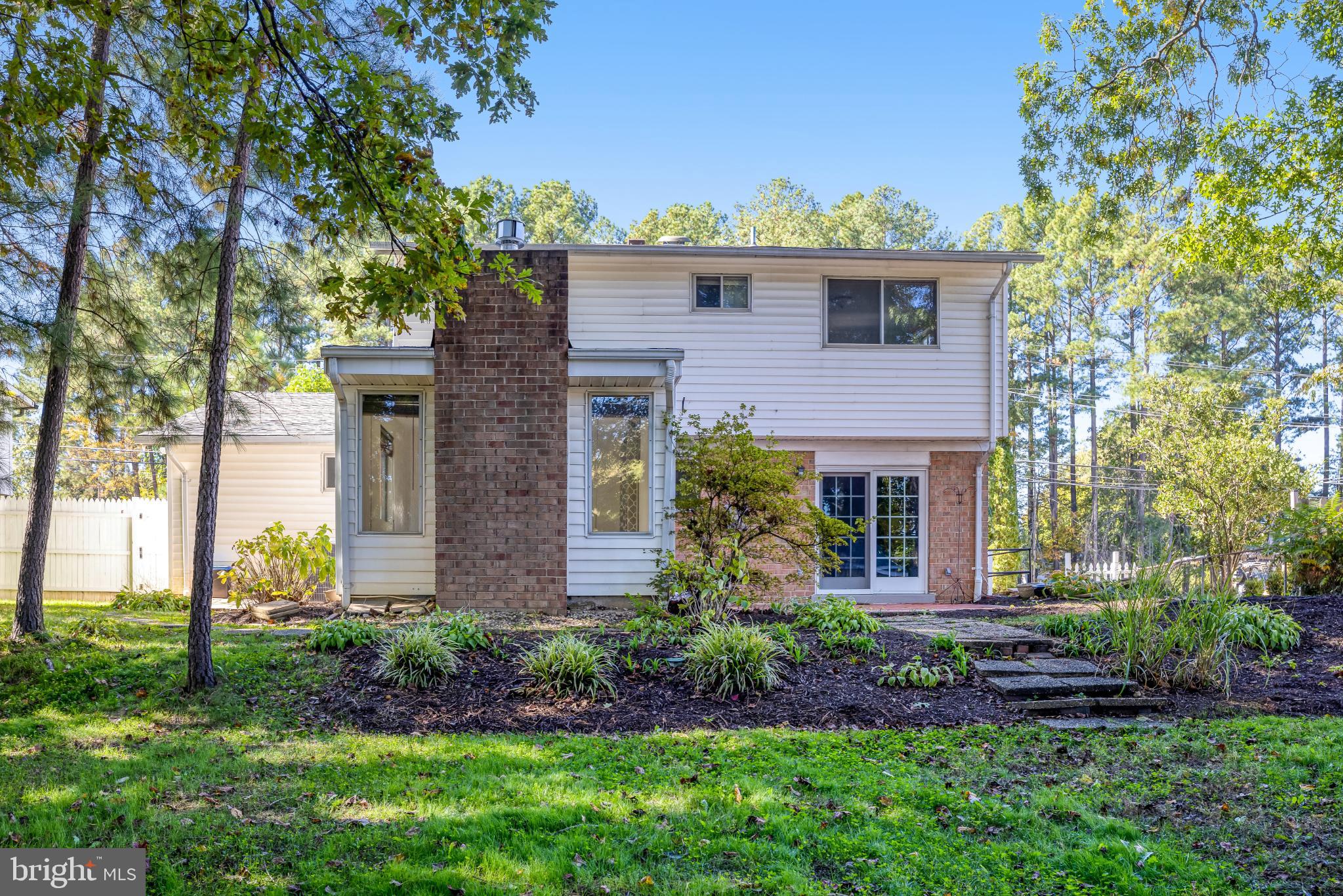 5609 Rolling Road Springfield, VA 22151 - Photo 38 of 42 Charming home nestled among lush greenery.