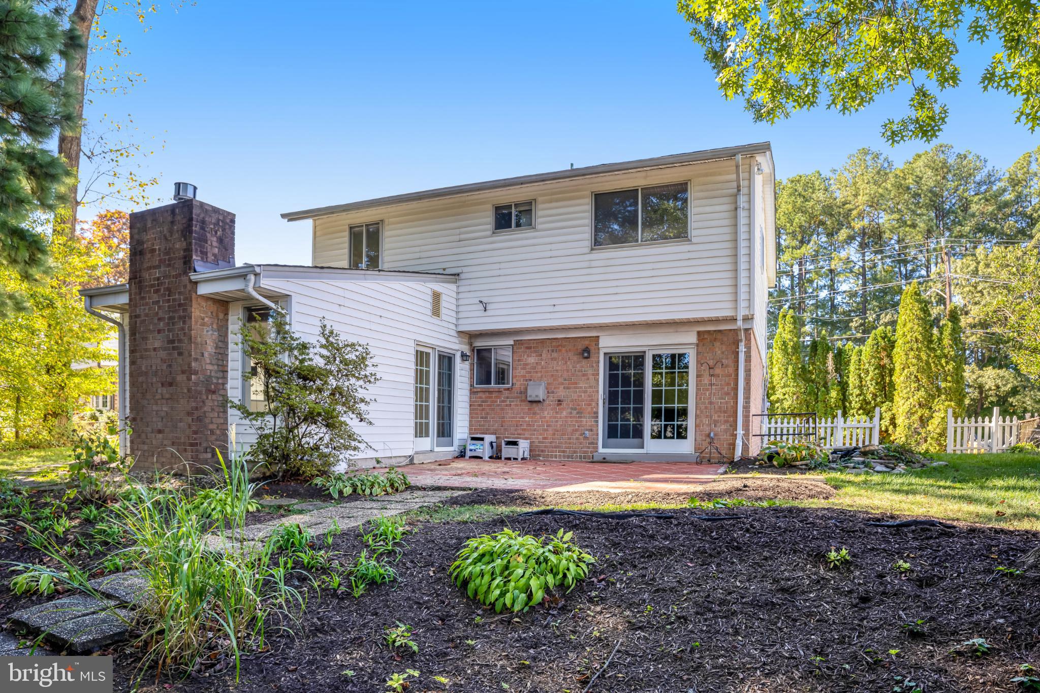 5609 Rolling Road Springfield, VA 22151 - Photo 40 of 42 Charming home with lush greenery and patio.