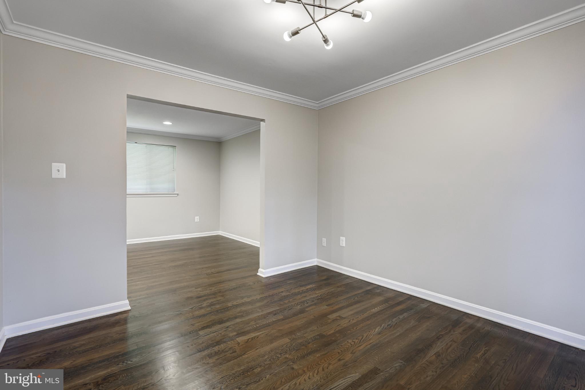 5609 Rolling Road Springfield, VA 22151 - Photo 9 of 42 Spacious, light-filled living area awaits.