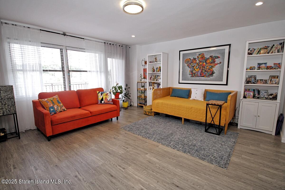 1000 Clove Road, Unit 7G Staten Island, NY 10301 - Photo 1 of 16 a living room with furniture and a large window