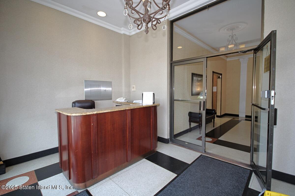 1000 Clove Road, Unit 7G Staten Island, NY 10301 - Photo 15 of 16 a view of hall way with mirror and furniture