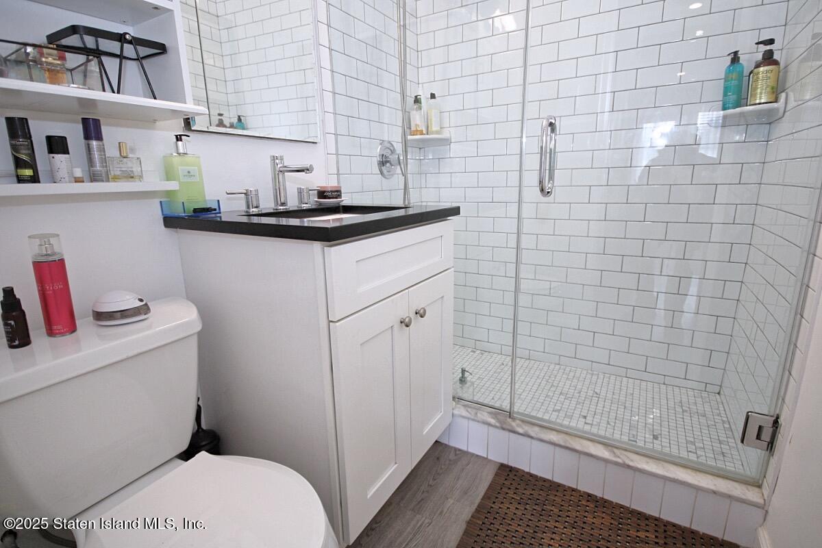 1000 Clove Road, Unit 7G Staten Island, NY 10301 - Photo 8 of 16 a bathroom with a sink and a toilet