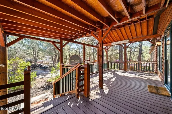 a view of a porch with wooden floor