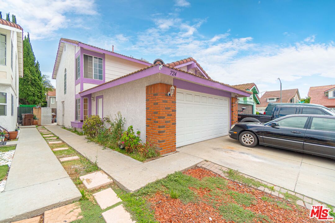 a view of a car parked in front of a house