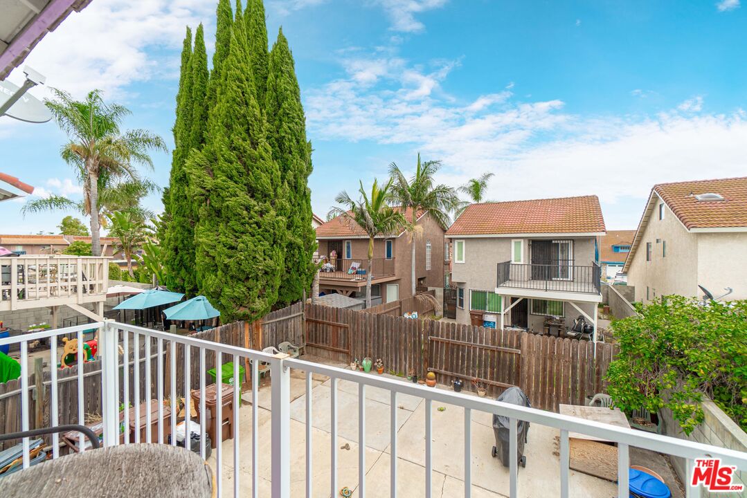 724 Anzac Circle Compton, CA 90220 - Photo 12 of 16 a view of a brick house with a yard and potted plants