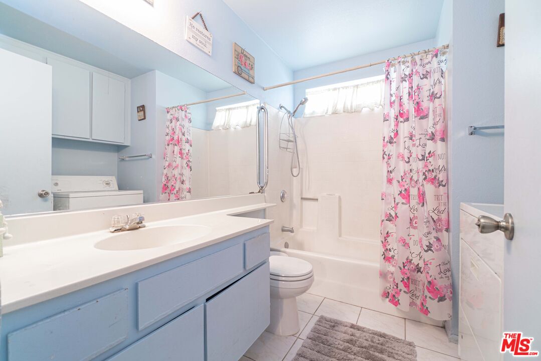 724 Anzac Circle Compton, CA 90220 - Photo 7 of 16 a bathroom with a sink a toilet and shower