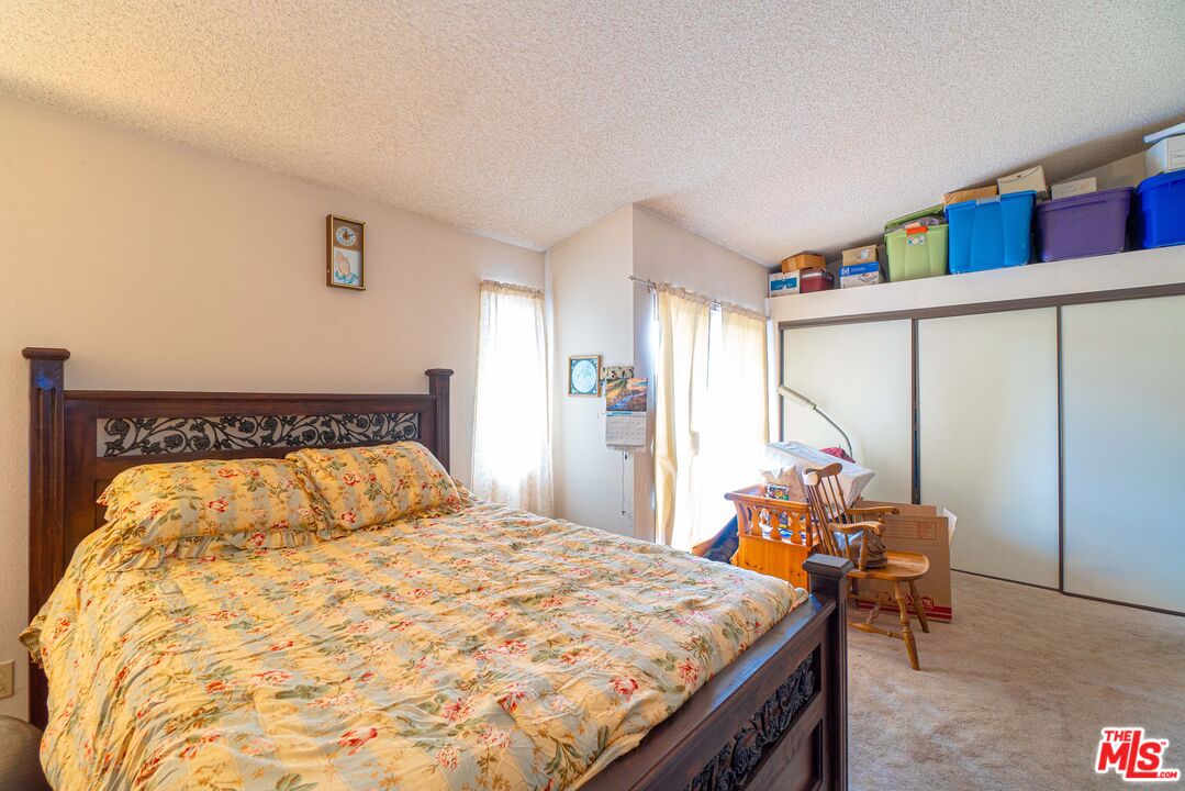 724 Anzac Circle Compton, CA 90220 - Photo 10 of 16 a bedroom with a bed and window