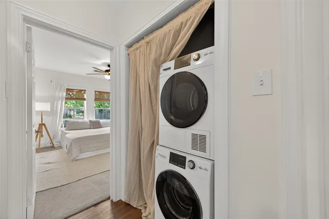 a bedroom with a large bed and window