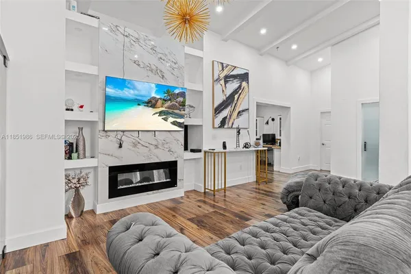 a living room with furniture and a fireplace