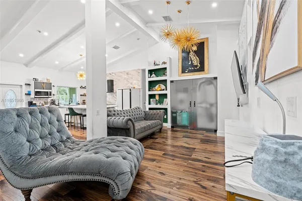 a bedroom with furniture and a window