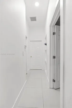 a bedroom with furniture and flat screen tv