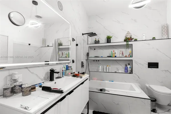 a view of a hallway with storage and utility