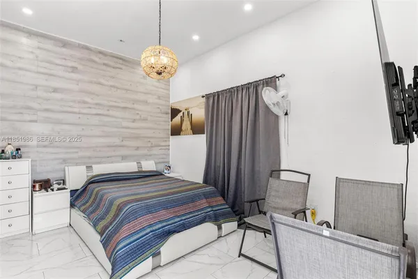 a bathroom with a sink toilet tub and shower