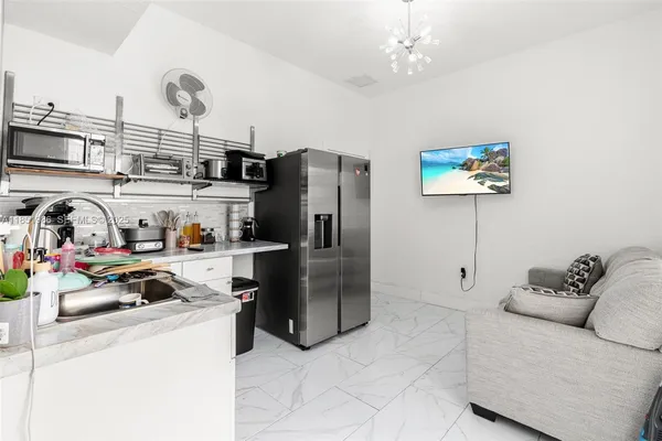 a bedroom with a bed and cabinets