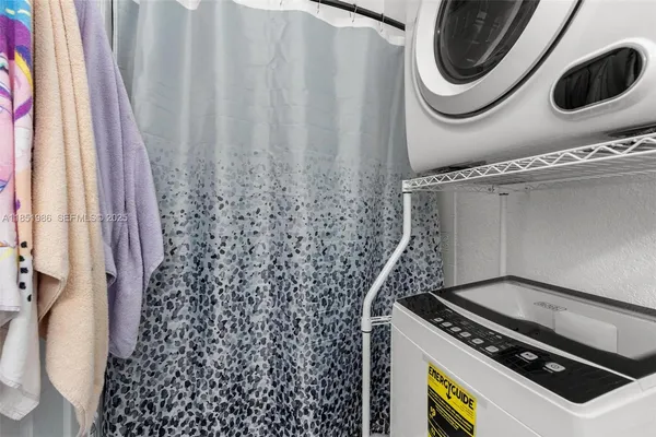 an aerial view of a house with outdoor space and lake view