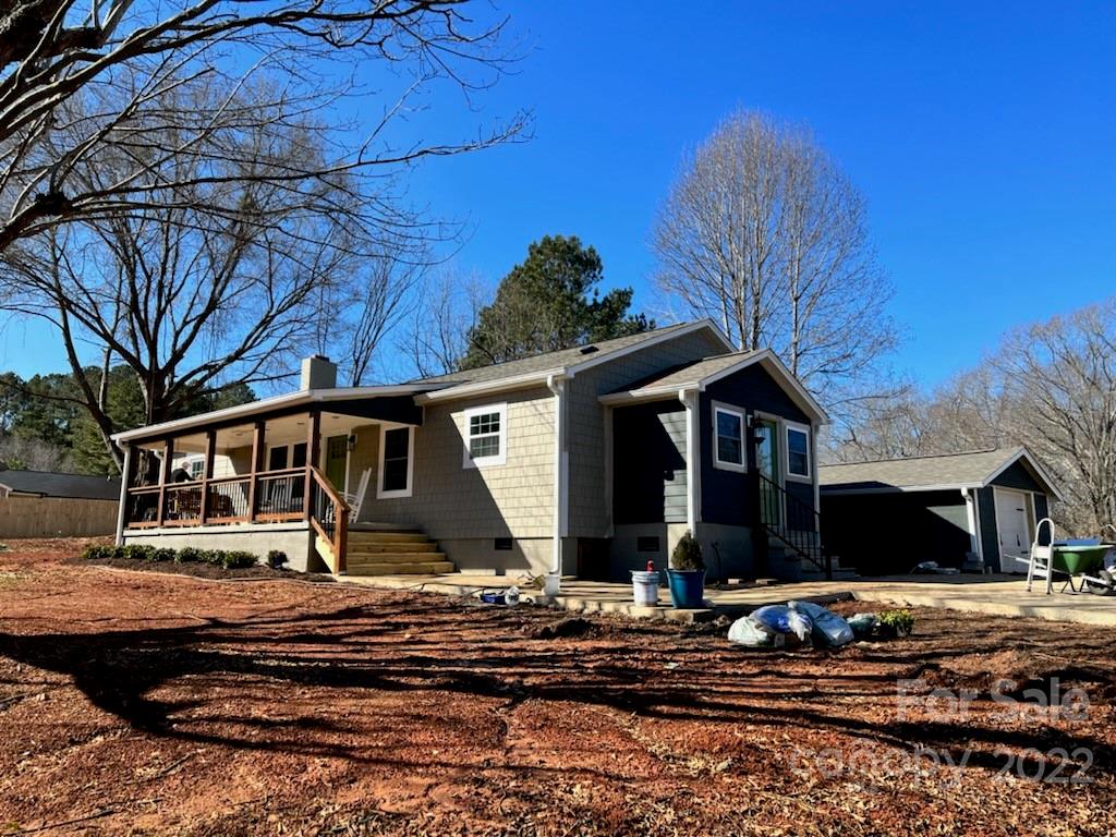 1415 Miles Road Dallas, NC 28034 - Photo 1 of 23 a front view of a house with a yard